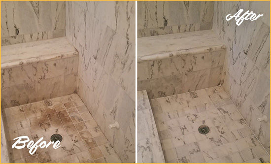 Before and After Picture of a Dirty Cross River Marble Shower Cleaned to Eliminate Dark Stains